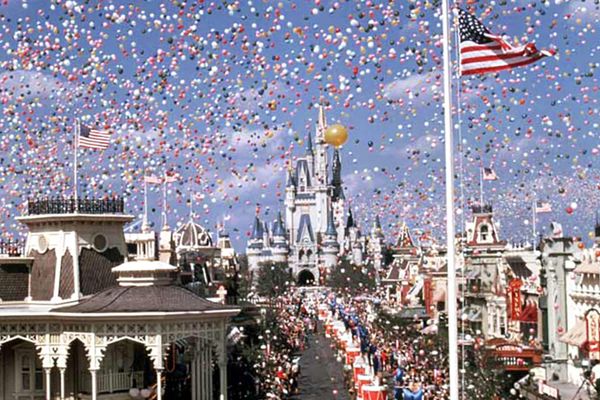 Cinderella castle and a crowd of guests at the grand opening of Walt Disney World in 1971.